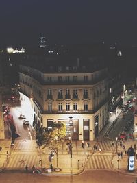 People on city street at night