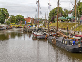 Fishing boats in river at harbor