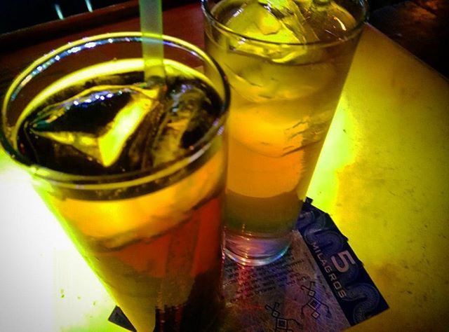 drink, food and drink, refreshment, drinking glass, freshness, indoors, still life, table, alcohol, yellow, close-up, glass - material, drinking straw, beer - alcohol, juice, beer glass, ice cube, focus on foreground, glass, cocktail