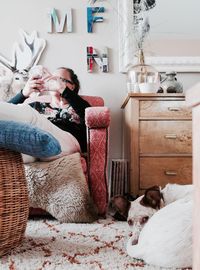 Close-up of dog lying on bed at home