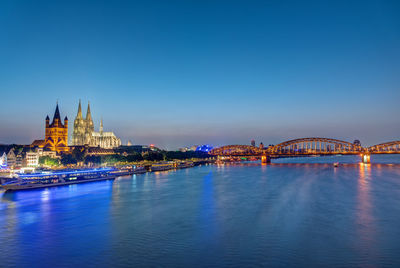 The famous skyline of cologne with the cathedral at dusk