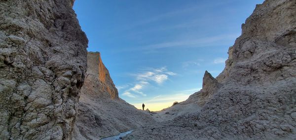 Rock formations on mountain against sky