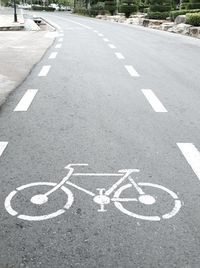 High angle view of arrow sign on road