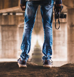 Low section of man wearing leather shoes