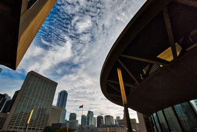 Low angle view of modern buildings against sky in city