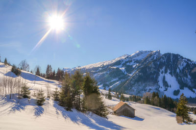 Scenic view of snowcapped mountains against sky