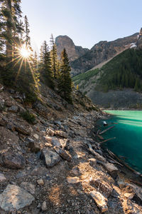 Scenic view of lake and mountains against clear sky