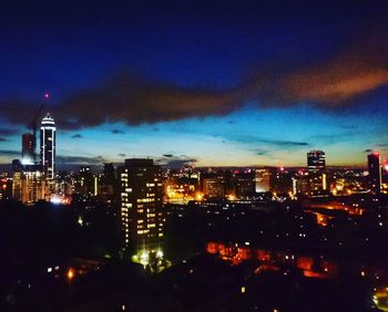 Aerial view of city lit up at night