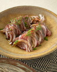 High angle view of food on a table. carpaccio made with bonito fish.