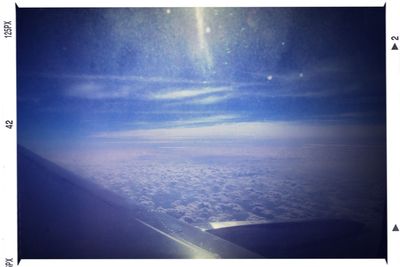 Aerial view of landscape against cloudy sky