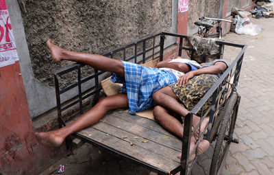 High angle view of man sitting on floor