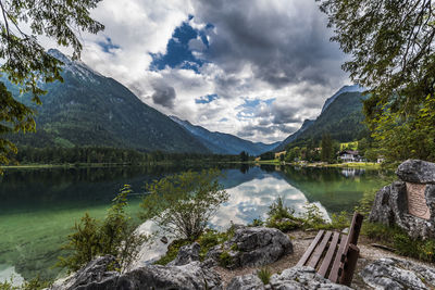 Scenic view of lake and mountains against sky