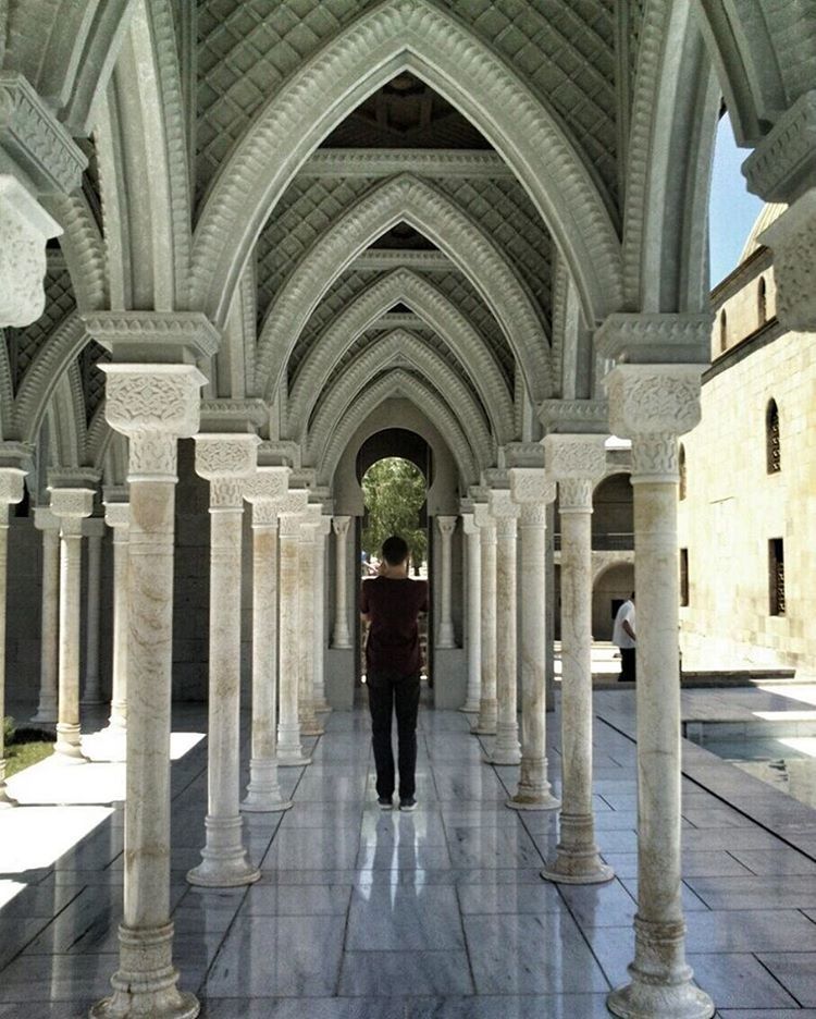 arch, architecture, indoors, spirituality, architectural column, built structure, flooring, tiled floor, place of worship, arcade, in a row, church, column, corridor, the way forward, architectural feature, history, long, day, archway, diminishing perspective