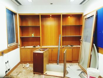 Empty chairs and tables in room