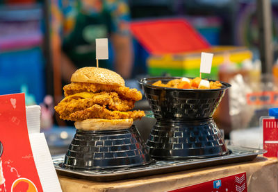 Chicken burger show on shop at a street food market.