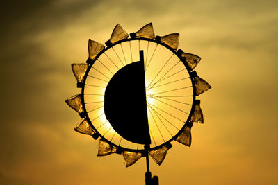 Pinwheel toy against sky during sunset
