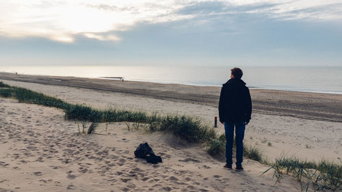 Silhouette of woman standing on beach