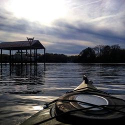 Pier on lake at sunset