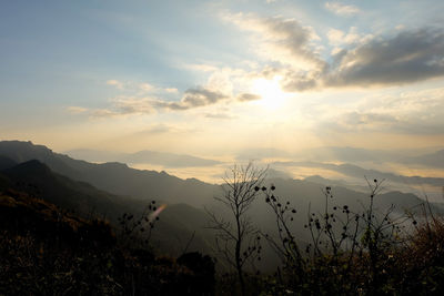 Scenic view of silhouette mountains against sky during sunset