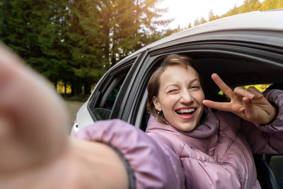 Portrait of happy woman in car