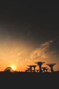 Silhouette plants against sky during sunset
