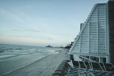 Scenic view of beach against sky during winter