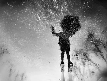 Low angle view of woman at night