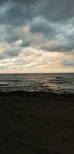 Scenic view of sea against sky at sunset