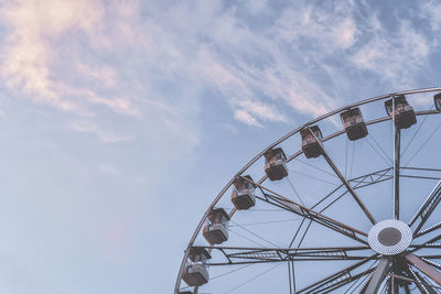 Low angle view of ferris wheel against sky