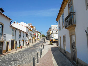 Empty alley amidst buildings in city