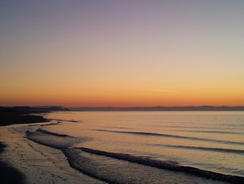 Scenic view of beach during sunset