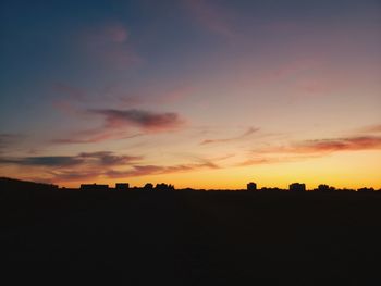 Silhouette landscape against sky during sunset