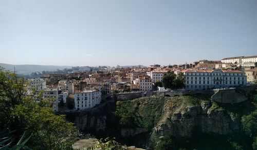 High angle view of buildings against clear sky