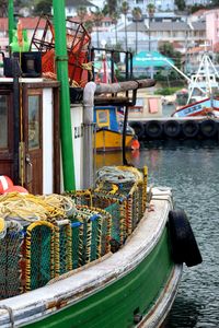 Boats moored at harbor