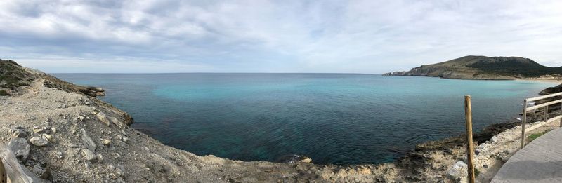 Panoramic view of bay against sky
