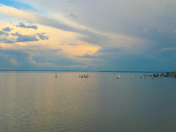 Scenic view of sea against sky at sunset