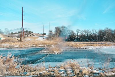 Scenic view of landscape against sky during winter