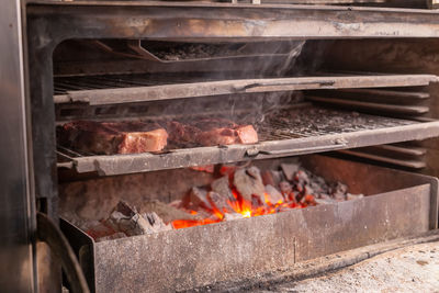 Close-up of meat on barbecue grill