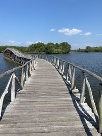 Pier over sea against sky