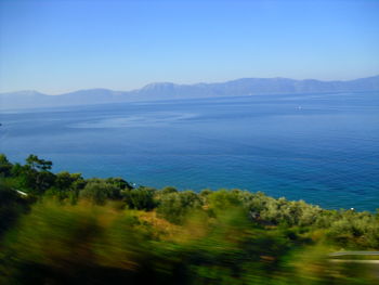 Scenic view of sea against clear blue sky