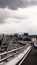 City street against cloudy sky