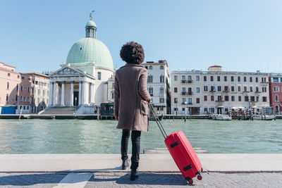 Tourist young woman going for vacation trip