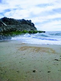 Scenic view of beach against sky