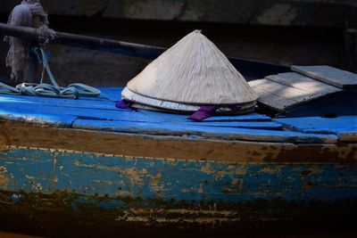 Close-up of old boat against blue water