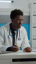 Portrait of doctor working at clinic