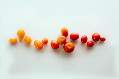 Close-up of tomatoes against white background