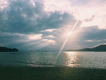 Scenic view of sea against dramatic sky