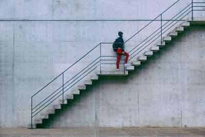 Rear view of man on staircase