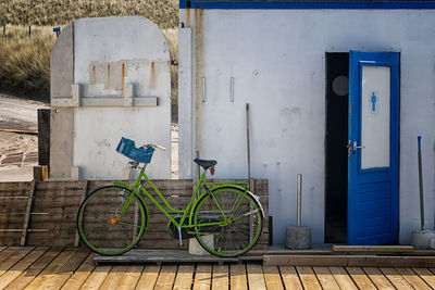 Green bike and blue door