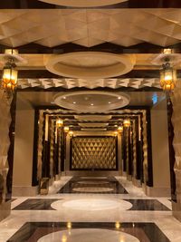 Illuminated lights on ceiling of building